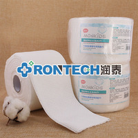 Machine à rouler et à découper les lingettes sèches en coton non tissé jetables pour cosmétiques