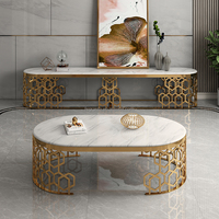 Table console moderne en acier inoxydable doré avec plateau en marbre et structure alvéolée pour salon