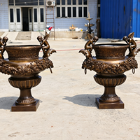 Macetero Urna de Bronce Fundido Grande Personalizado con Ángel Querubín para Jardín y Proyectos Hoteleros, Estatua Clásica Ornamentada para Macetas, Fabricante