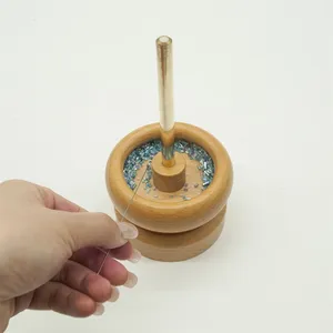 Dispositif de rotation de perles avec 2 aiguilles rotatives manuelles