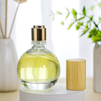 A-Best Flacon de parfum rond en verre haut de gamme avec pulvérisateur et impression sérigraphique disponible en tailles 30ml/50ml/100ml