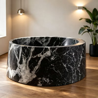 Baignoire double autoportante de luxe en marbre noir rond, baignoire en pierre naturelle pour hôtel et villa ultra-luxe