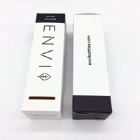 Caja de embalaje de bálsamo labial en relieve de estilo moderno con logotipo personalizado para cosméticos