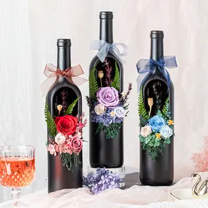 Veri fiori stabilizzati confezionati in bottiglia di vino per regalo aziendale regalo di laurea