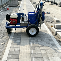 Machine de marquage routier par pulvérisation à froid sans air avec système de peinture à changement rapide pour travaux multicolores