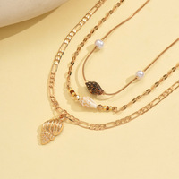 Ensemble de colliers longs à pendentifs multicouches en coquillage et perles dorées, style vacances d'été, minimaliste et luxueux