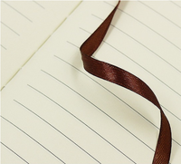 Vente en gros Cahier A5 personnalisé d'excellente qualité avec couverture en tissu avec boucle pour stylo pour fournitures de bureau