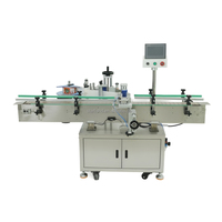 Machine d'étiquetage automatique pour bouteilles rondes, flacons, boîtes de conserve et pots, avec application d'étiquettes sur un ou deux côtés en plastique ou verre
