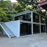 Bâtiment de bureau modulaire préfabriqué en conteneurs détachables avec murs en verre pour villas de villégiature et hébergements touristiques