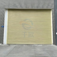 Porte à enroulement en acier robuste avec fonction antivol, porte roulante industrielle Qianou pour entrepôt, usine, prix bas