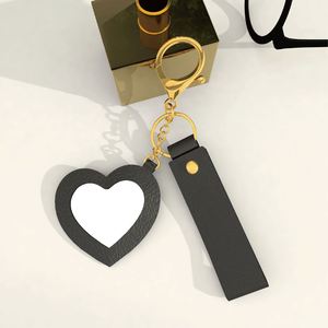 Low MOQ Cute and Creative Small PU <b>Leather</b> Heart-shaped Mirror <b>Keychain</b> with Many Colors for Bag Pendant in Stock - Product Image 6