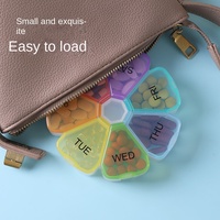 Boîte de rangement portable mini transparente à sept compartiments pour médicaments et pilules, motif fleur, grande capacité, colorée, pour usage transfrontalier