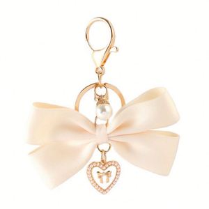 Porte-clés élégant en gros avec nœud papillon, magnifique breloque créative, pendentif souple pour sac, cadeaux de festival pour femmes - Product Image 5