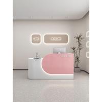 Comptoir de réception simple en MDF rectangulaire arrondi pour magasin de vêtements, salon de beauté, studio de yoga, design style crème, finition cuite