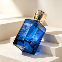 Flacon de parfum en verre octogonal bleu facetté de luxe sur mesure OEM 100 ml avec bouchon couronne doré pour fragrance
