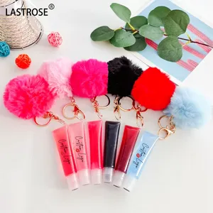 Atacado tubo de apertar brilho labial Lipgloss de marca própria óleo de brilho labial com pompom brilhante vegano