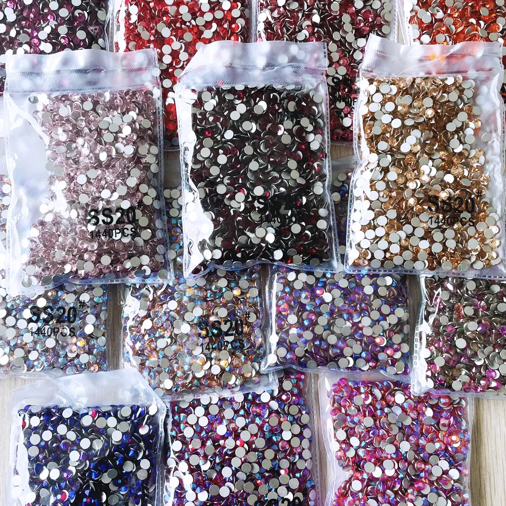 Mais popular em strass não hotfix para decoração de unhas atacado fábrica com mais de 100 cores cristal conjunto de strass costurados 2 sacos