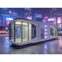 Maison conteneur préfabriquée en kit de type capsule spatiale pour l'extérieur, avec panneaux sandwich, design moderne et système intelligent, pour usage hôtelier