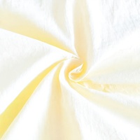 Tissu jersey 100 % nylon de poids moyen, résistant à l'abrasion, avec revêtement PU imperméable, imprimé à pois, teint, pour manteau d'extérieur tendance