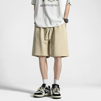 Shorts pour hommes de couleur unie, nouvelle collection été, style décontracté américain, tendance, coupe ample, avec cordon de serrage, jambe droite