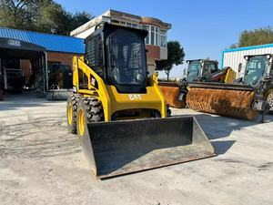 รถตักล้อยาง CAT 2460 สีเหลือง อุปกรณ์ก่อสร้างขนาดกะทัดรัด น้ำหนัก 3000 กก. เครื่องยนต์ 0-2000 ชั่วโมง - Product Image 5