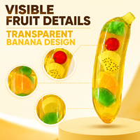 Vente en gros de jouets à presser en forme de banane géante transparente, remplis de fruits, avec boîte de vente au détail et présentoir en carton