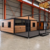 Maison conteneur modulaire pliable de luxe de 20 pieds, design moderne, toit incliné, cadre noir personnalisé, mur imperméable, pour hôtel et appartement rapide