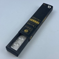 Boîte d'emballage pour barre chocolatée avec couvercle coulissant noir mat et insert en plastique pour truffes au chocolat