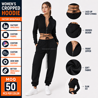 Ensemble de survêtement streetwear deux pièces pour femme, coupe ajustée, avec sweat à capuche court zippé à lacets et pantalon de jogging, personnalisable, vente en gros