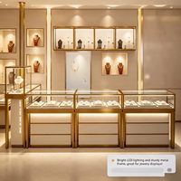 Vitrine à bijoux en or avec éclairage LED et verre, présentoir écologique pour parfums et bijoux pour les magasins de détail