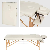 Table de massage pliable portable en cuir synthétique moderne de haute qualité, confortable et durable, idéale pour les salons de beauté, les spas et les massages thaïlandais.