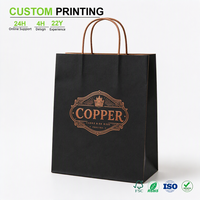 Sac en papier noir imprimé sur mesure avec emblème en feuille de cuivre et poignée en corde de papier torsadée pour emballage de vente au détail en boutique, vente en gros