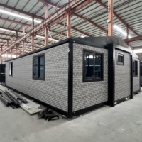Maison en acier modulaire extensible avec panneaux sandwich en bois pour villa, bureau, parc, chambre et salon