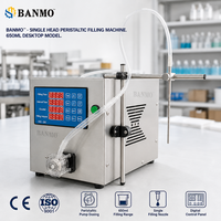 Machine de remplissage à pompe péristaltique à tête unique BANMO pour miel et sirop, dotée d'un panneau de minuterie à quatre rangées pour des doses répétées de 650 ml