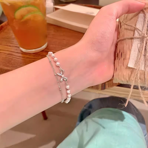 สร้อยข้อมือประดับมุกสำหรับผู้หญิง ให้ความรู้สึกหรูหราเบาๆ และมีเสน่ห์อย่างมีระดับ สร้อยข้อมือหินตาแมว เครื่องประดับสไตล์ใหม่ - Product Image 1