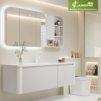 Meuble-lavabo flottant moderne de style côtier, en contreplaqué blanc avec panneau cannelé et bord arrondi, vasque en céramique, miroir LED et armoire latérale avec niche
