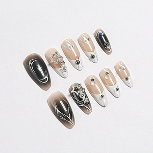 Faux ongles à presser 3D en amande, tendance, noirs et nude, avec French manucure, étoiles et strass, et colle – Vente en gros - Product Image 1