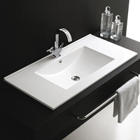 Meuble-lavabo de salle de bain en céramique blanche moderne Lavabo à main au design simple avec montage sur robinet monotrou