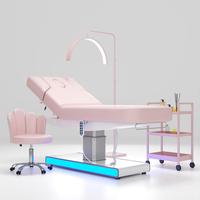 Cama de belleza eléctrica de lujo para salón de Spa, cama Robot de masaje para salón, mesa de masaje portátil moderna, cabezal Facial de madera, cama de masaje