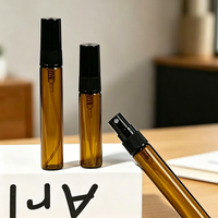Vente en gros de mini flacons cylindriques de luxe en verre ambré pour échantillons de parfum, atomiseurs à bouchon à vis, 2ml 3ml 5ml 10ml, emballage vide pour huiles