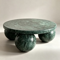 Table basse ronde de luxe en marbre vert avec base sphérique en marbre naturel au design minimaliste