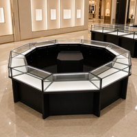 Vitrine à bijoux en verre octogonale personnalisée, cadre noir, finition dorée, éclairage LED pour magasin de détail, boutique, distributeur en gros