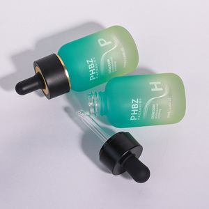 Flacon compte-gouttes en verre dégradé vert de 30 ml pour huile essentielle et sérum, avec bouchon noir et or, emballage personnalisé pour soins de la peau et cosmétiques - Product Image 1