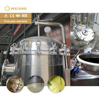 Machine de remplissage de liquides semi-épais (miel) avec réservoir de mélange de 1000 L et système de pesage à double tête