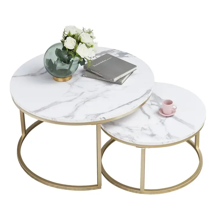 2 Nesting Tables features a gleaming gold base and marble-inspired tops coffee table home furniture