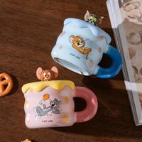 Vente en gros de tasses à eau amusantes pour anniversaire, tasse à café en céramique avec couvercle, motif Tom et Jerry