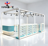 Meuble de magasin mobile moderne haut de gamme, vitrine murale pour étuis de téléphone et électronique pour la vente au détail de téléphonie mobile