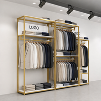 Étagères de présentation de vêtements en acier inoxydable doré sur mesure, 2 niveaux, sur pied, pour boutiques