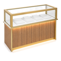 Vitrine îlot en acier inoxydable à grain de bois avec finition dorée et éclairage LED pour bijoux, parfums, cosmétiques, showroom, vente en gros