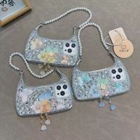 Coque de téléphone de luxe antichoc pour femme avec dragonne diamantée, strass, papillon, perle et fleur pour iPhone 13/14/15/16/17